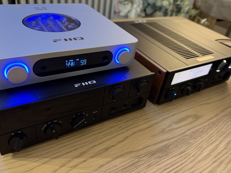 the same three units from a lower angle, the k13 r2r’s blue-lit knobs and window over its resistor board visible above the k17