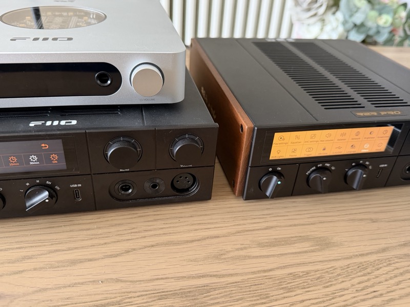 the k17 r2r with its walnut cheek and r2r pro badge beside the original k17, which has the silver k13 r2r stacked on top of it