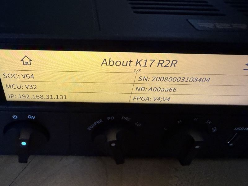 the about screen showing soc, mcu and fpga firmware versions plus the unit’s ip address