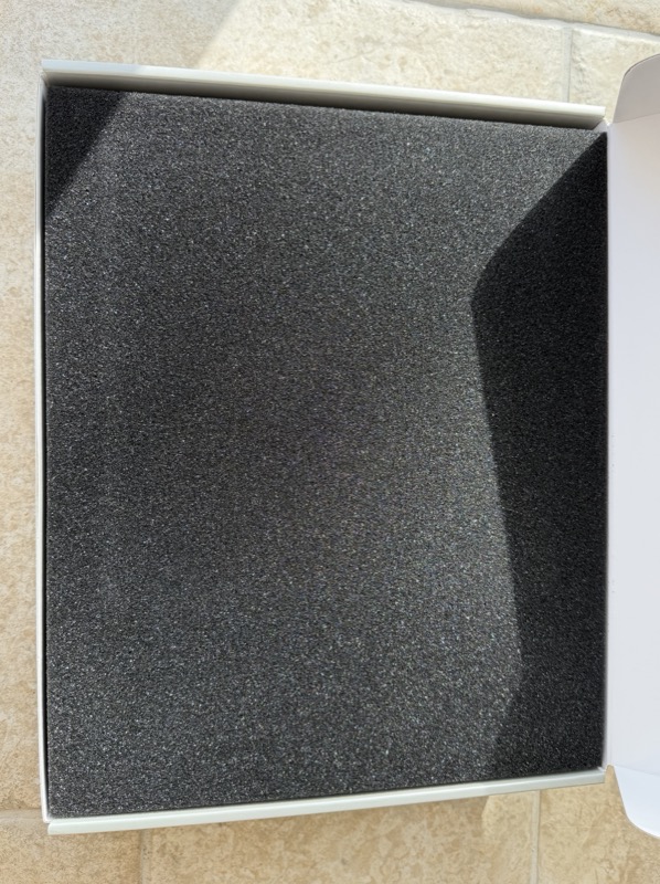black foam packing insert in the base of the box