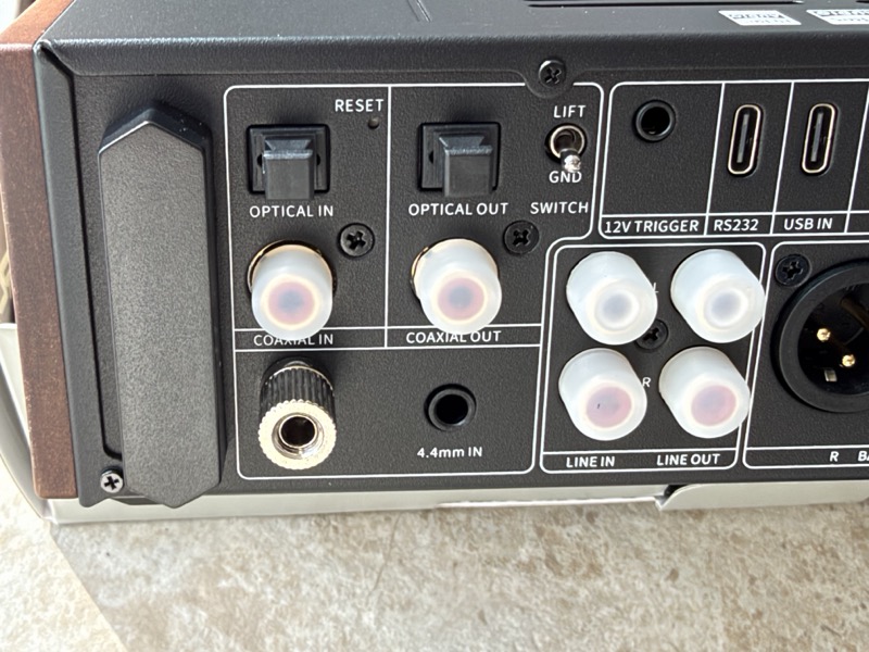 left of the rear panel with optical in and out, coaxial in and out, ground lift, 4.4mm balanced input and rca line in and out