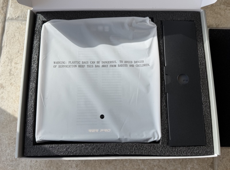 the k17 r2r wrapped in a printed plastic bag inside its foam tray