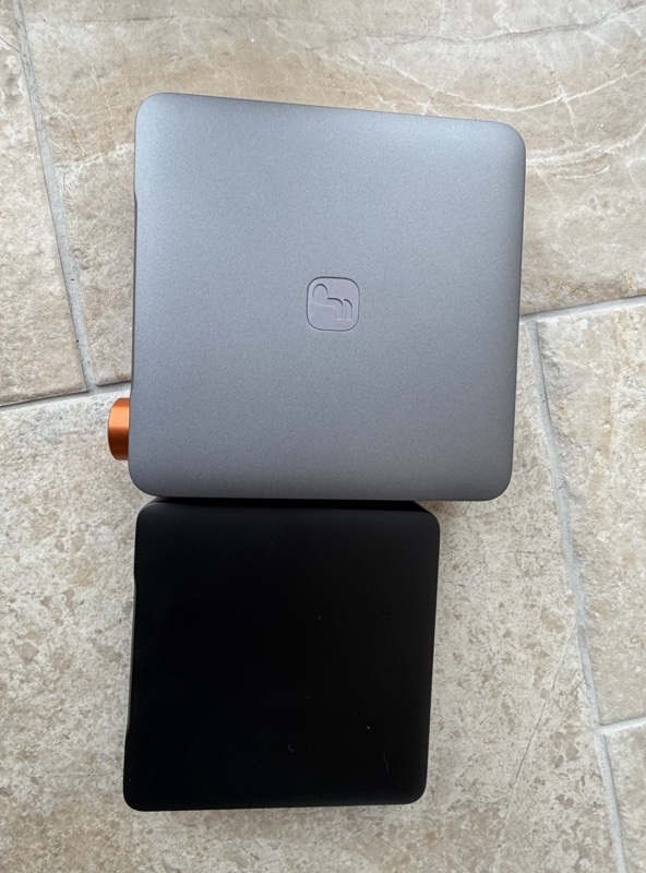 the s3 and s3 lite from above, the black lite showing a smaller footprint than the silver s3