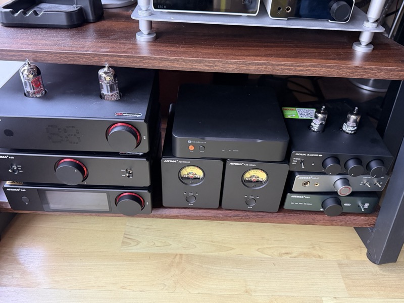 the s3 lite in a rack above aiyima mono amplifiers and douk audio gear