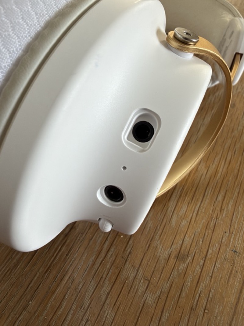 the underside of the left earcup showing the microphone socket and the 3.5 mm jack